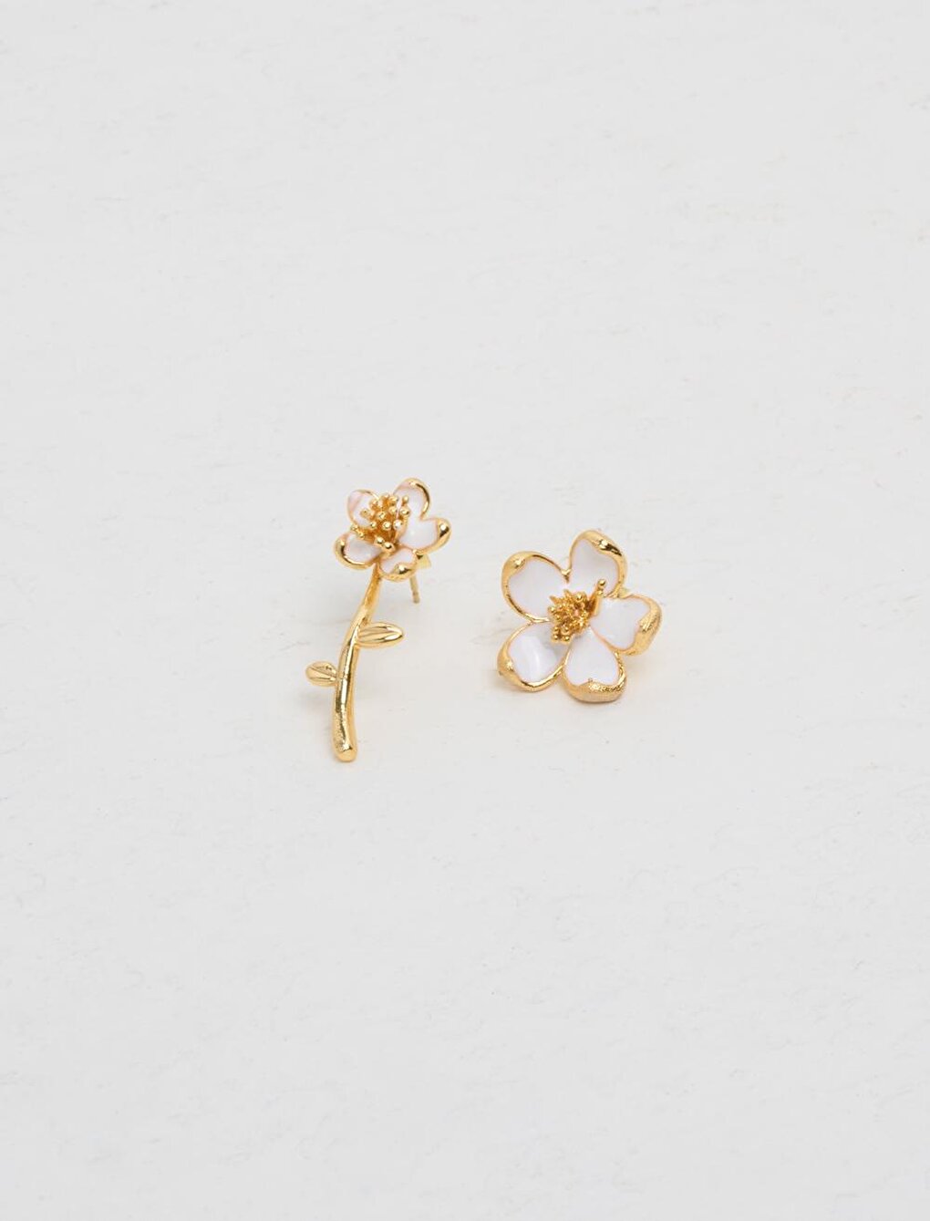 Different Pair of Earrings with White Flower Figures