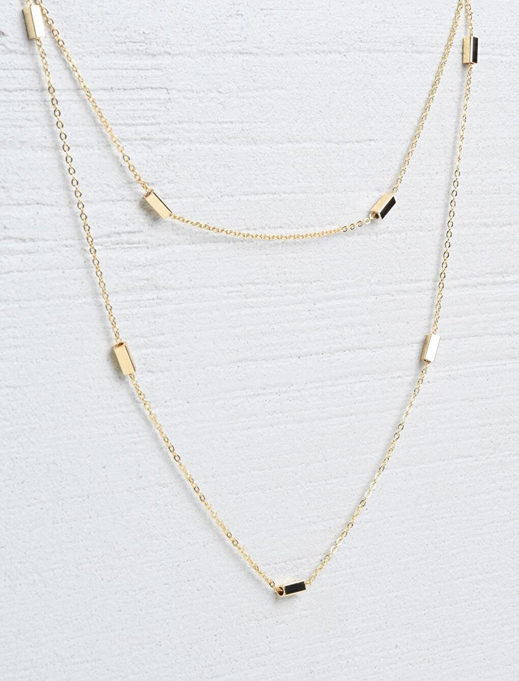 Stylish Double Chain Necklace with Gold Bar Figure