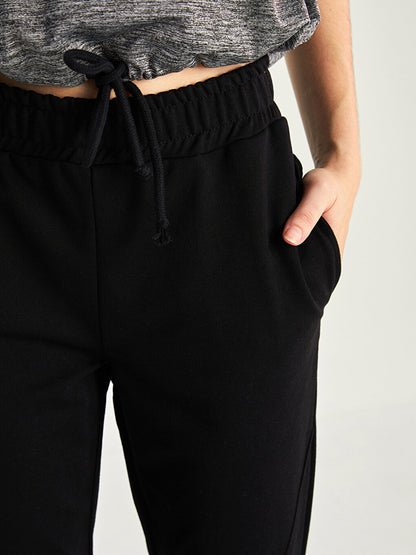 Women's Sports Sweatpants with Elastic Waist Pocket Detail